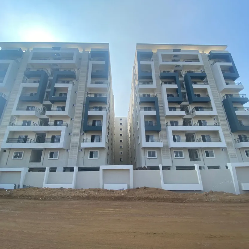Two apartment towers side by side behind a boundary wall at HPR Lakefront