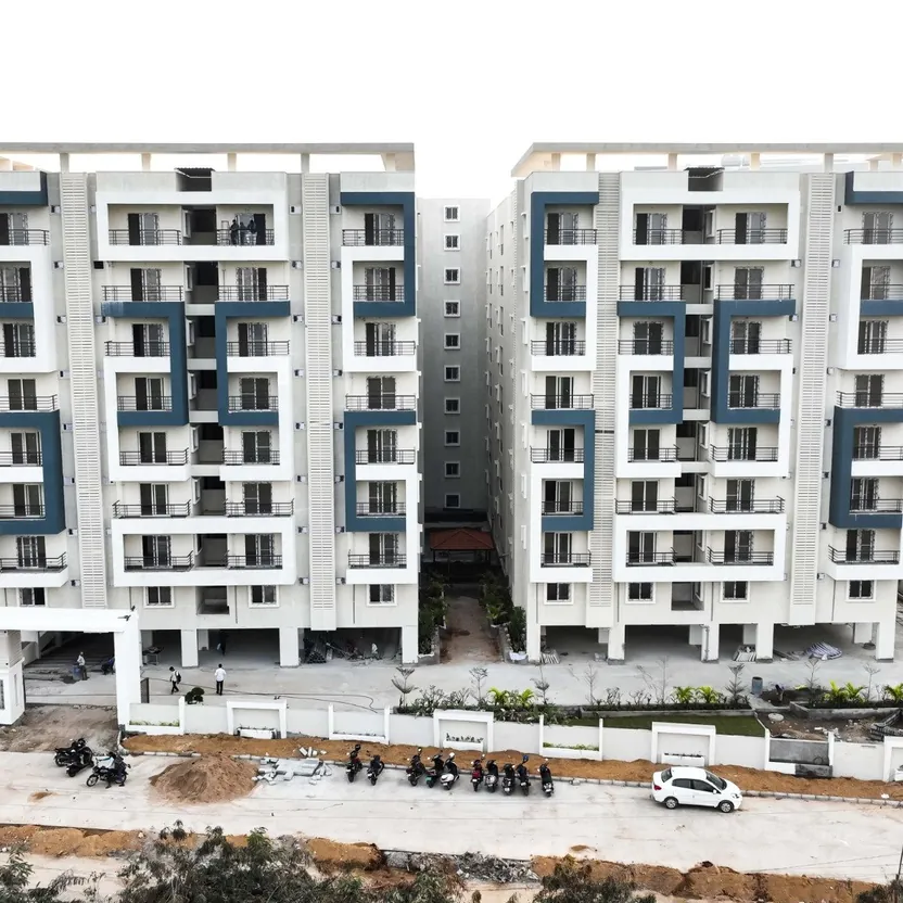 Two apartment towers and the entrance road seen from above at HPR Lakefront